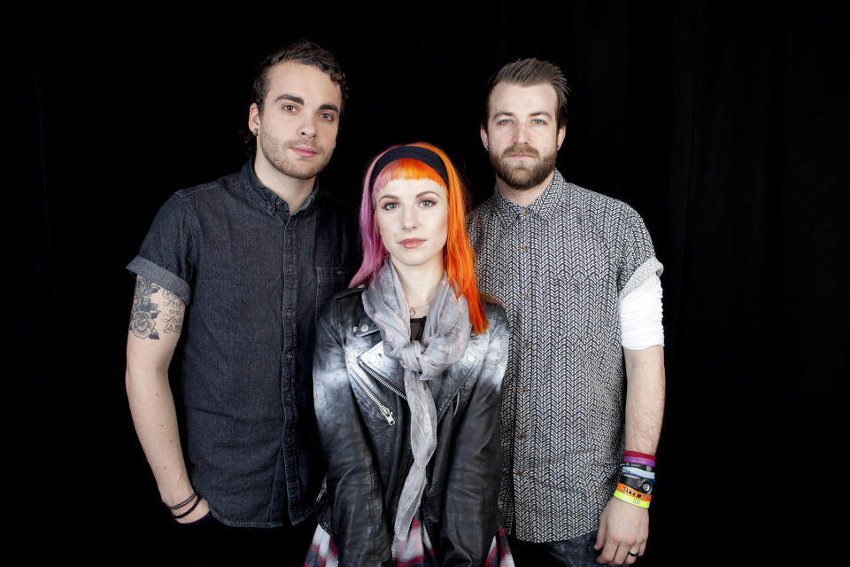 This April 8, 2013 photo shows from left, Taylor York, Hayley Williams and Jeremy Davis, of the American rock band Paramore posing for a portrait in New York. (Photo by Amy Sussman/Invision/AP)