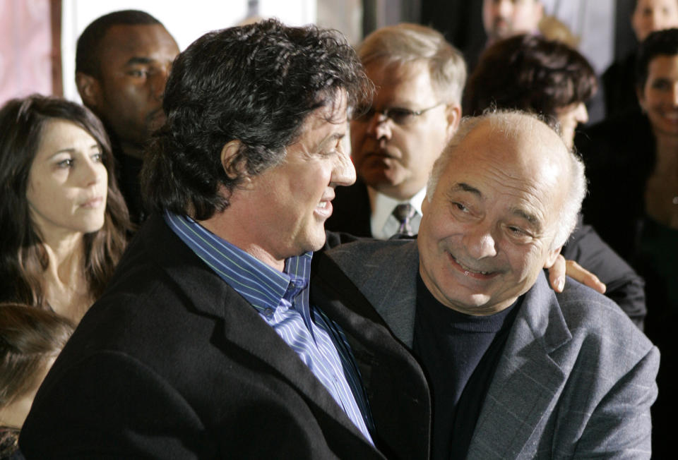 FILE - Sylvester Stallone, left, star of the movie "Rocky Balboa," and cast member Burt Young attend the film's premiere in Philadelphia, Dec. 18, 2006. Burt Young, the Oscar-nominated actor who played Paulie, the rough-hewn, mumbling-and-grumbling best friend, corner-man and brother-in-law to Sylvester Stallone in the “Rocky” franchise, has died. Young died Oct. 8, 2023 in Los Angeles. (AP Photo/Matt Rourke, File)