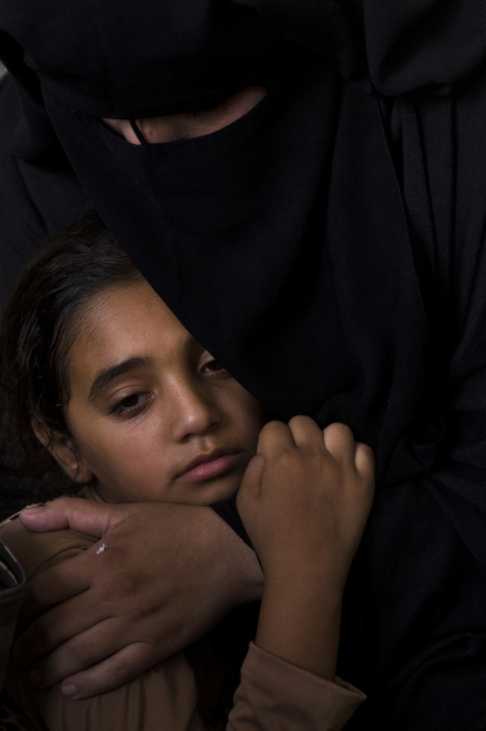 CORRECTS AGE FROM 12 TO 11 - Palestinian relatives of 11 year-old boy, Majdi al-Satari, who was shot and killed by Israeli troops on Friday's ongoing protest at the Gaza Strip's border with Israel, mourn at the family home during his funeral in town of Rafah, Southern Gaza Strip, Saturday, July 28, 2018. Gaza health officials said two Palestinians were killed and dozens injured by Israeli fire at a weekly border protest on Friday. (AP Photo/Khalil Hamra)