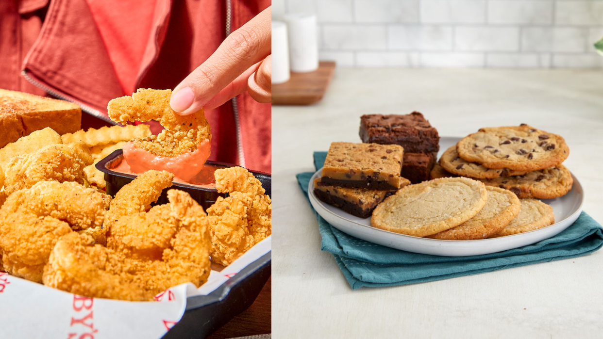 a hand holding a finger over a plate of food