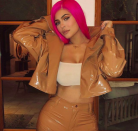 <p>Kylie Jenner debuts a fluro pink do for Coachella, saying on Instagram "I'm a cool mum".</p>