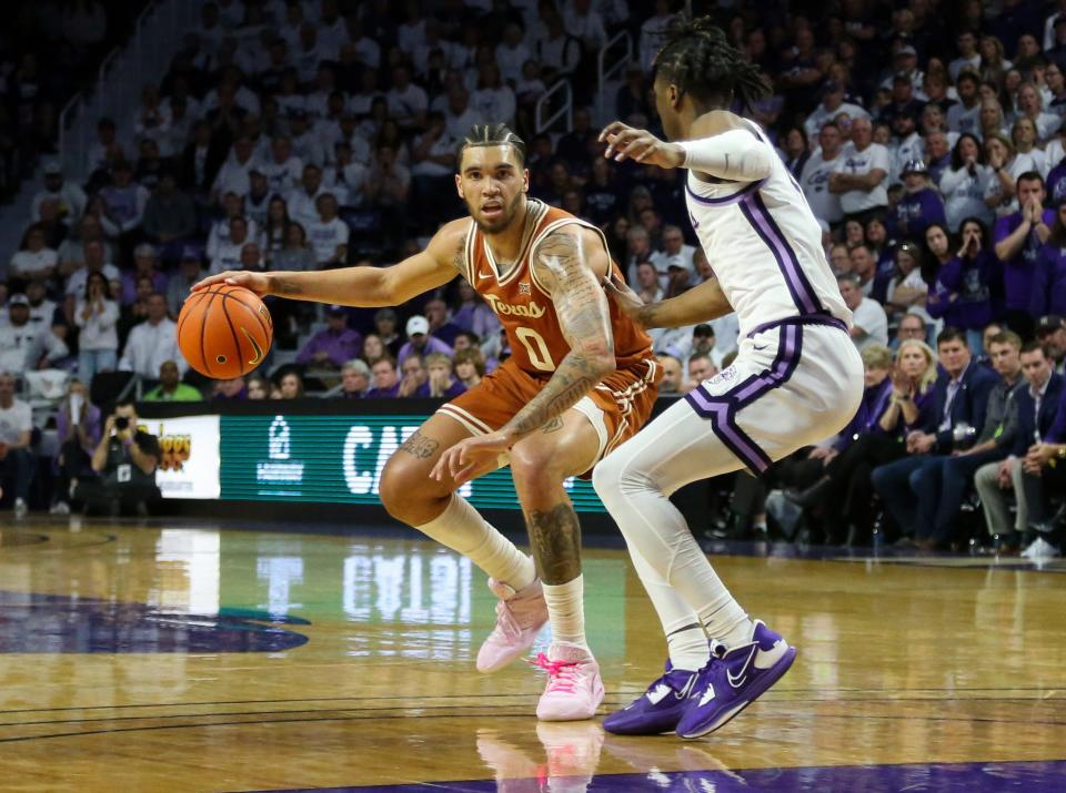 Texas forward Timmy Allen, left, dribbles the ball as Kansas State guard Cam Carter defends during a Big 12 game earlier this season. Allen and the Longhorns enter the final two games of the regular season with plenty on the line, including a Big 12 regular-season title and seeding in both the Big 12 and NCAA tournaments.