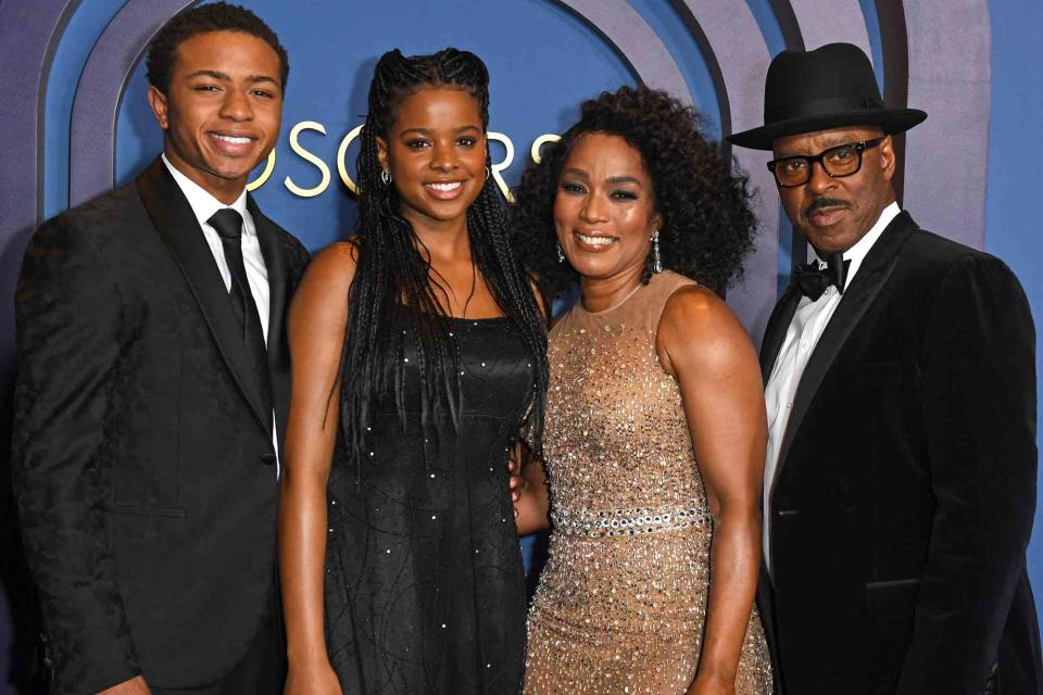 <p>VALERIE MACON/AFP via Getty</p> Angela Bassett and family