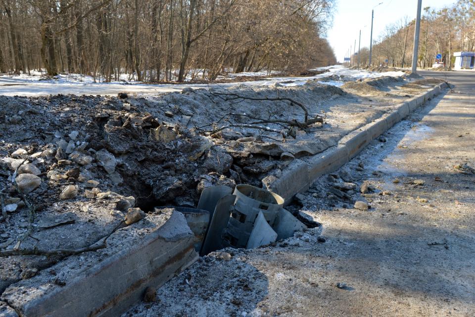 A rocket body stuck into a road after recent shelling on the northern outskirts of Kharkiv on February 24, 2022. - Russian President Vladimir Putin launched a full-scale invasion of Ukraine on Thursday, forcing residents to flee for their lives and leaving at least 40 Ukrainian soldiers and 10 civilians dead. Russian air strikes hit military facilities across the country and ground forces moved in from the north, south and east, triggering condemnation from Western leaders and warnings of massive sanctions. (Photo by Sergey BOBOK / AFP) (Photo by SERGEY BOBOK/AFP via Getty Images)