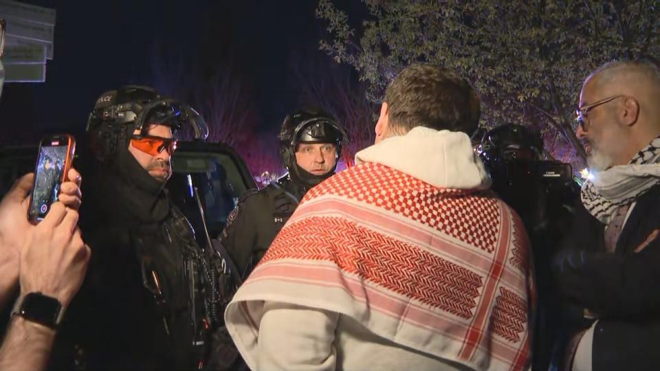 Police and protest organizers discuss breaking up a pro-Palestinian encampment late Thursday on the University of Calgary campus. The protestors packed up their supplies and left with no arrests. Most of them said they would be back on Friday.