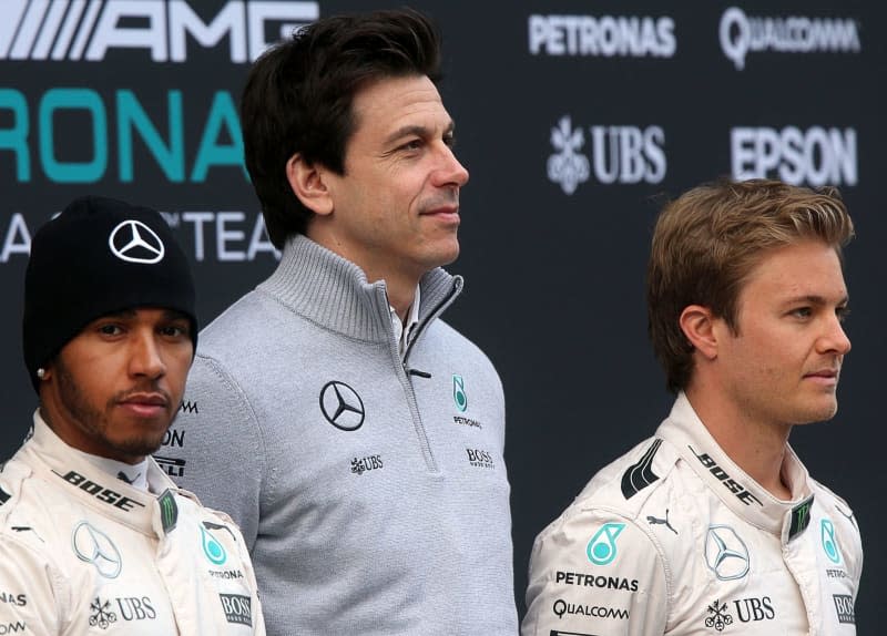 German Formula One driver Nico Rosberg (R) and British Formula One driver Lewis Hamilton (L) of the Mercedes AMG Petronas Team and Austrian Mercedes Head of Motorsport Toto Wolff (C) are seen at the presentation of the new W07 car for the Formula One season at the Circuit de Barcelona - Catalunya in Barcelona. Jens Büttner/dpa
