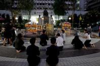 People pray for Thailand's late King Bhumibol Adulyadej at the Siriraj hospital in Bangkok, Thailand, October 14, 2016. REUTERS/Chaiwat Subprasom