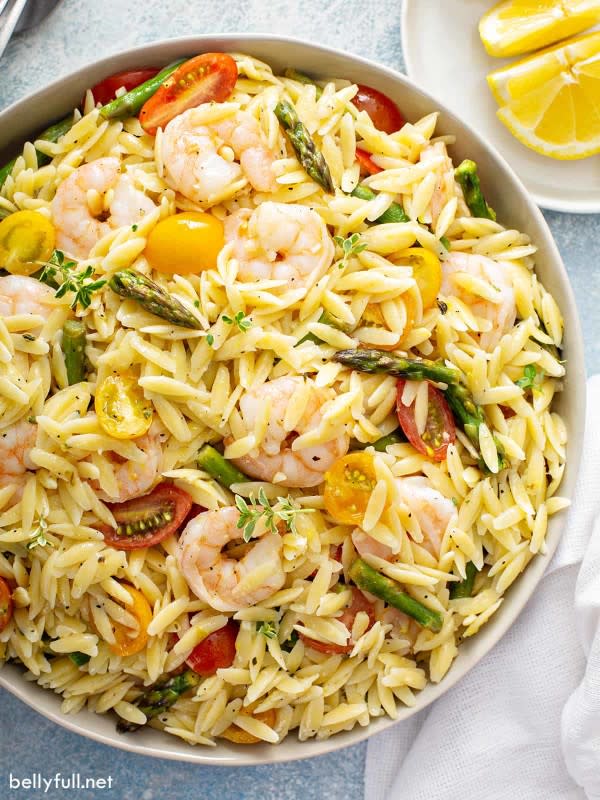 <p>Belly Full</p><p>This orzo salad screams springtime with orzo pasta, juicy shrimp, sweet cherry tomatoes, beautiful ripe asparagus, all tossed in a bright lemon dressing. It’s filling, but light, and perfect as a side or main course at home, or for a potluck.</p><p><strong>Get the recipe: </strong><a href="https://bellyfull.net/lemon-mustard-orzo-salad/?fbclid=IwAR3hRanHTn1GJGLeyFXGa6GuLPtkSe0lb2EC_zLFfLMRKQqmKAvKTJYVoo8" rel="nofollow noopener" target="_blank" data-ylk="slk:Lemon Orzo Salad;elm:context_link;itc:0;sec:content-canvas" class="link rapid-noclick-resp"><strong>Lemon Orzo Salad</strong></a></p><p><strong>Related: <a href="https://parade.com/1350596/christinehadden/chicken-leg-recipes/" rel="nofollow noopener" target="_blank" data-ylk="slk:40 Chicken Leg Recipes For Dinner;elm:context_link;itc:0;sec:content-canvas" class="link rapid-noclick-resp">40 Chicken Leg Recipes For Dinner</a></strong></p>