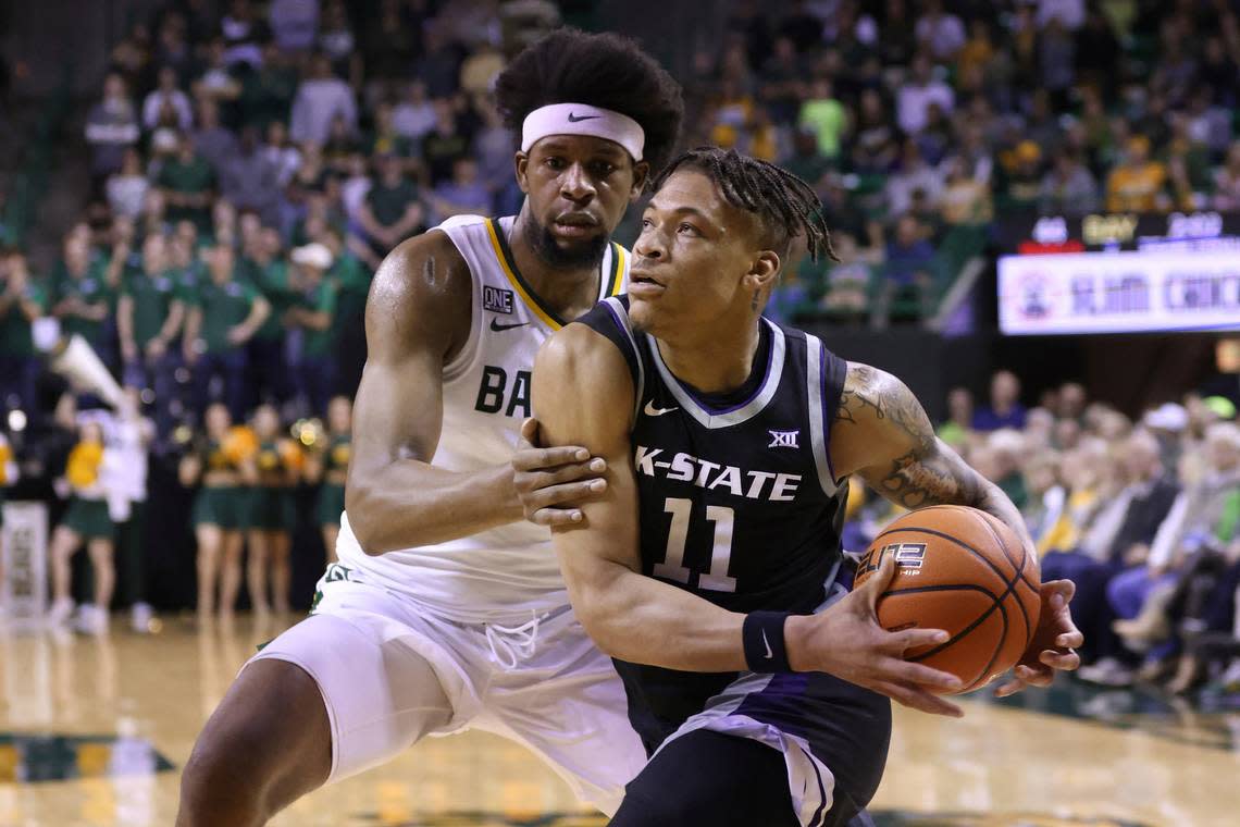 Kansas State forward Keyontae Johnson (11) drives to the basket against Baylor forward Flo Thamba, left, in the first half of an NCAA college basketball game, Saturday, Jan. 7, 2023, in Waco, Texas. (AP Photo/Rod Aydelotte)