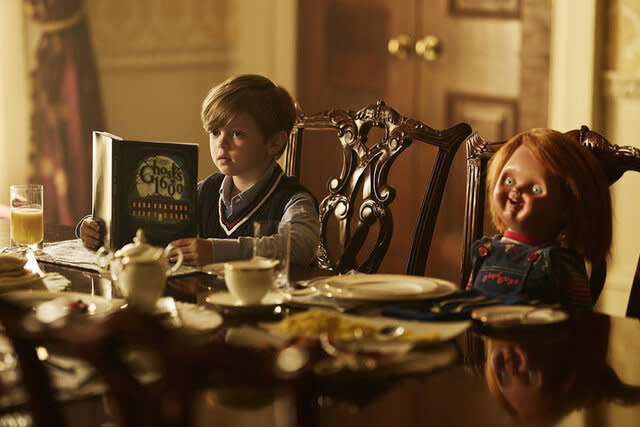 Henry Collins (Callum Vinson) reads a book while dining with Chucky in Chucky 301.