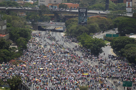 Opposition supporters attend to a rally against Venezuela's President Nicolas Maduro in Caracas, Venezuela April 24, 2017. REUTERS/Christian Veron