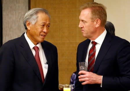Singapore's Defense Minister Ng Eng Hen and Acting U.S. Defense Secretary Patrick Shanahan are seen at a ministerial roundtable at the IISS Shangri-la Dialogue in Singapore