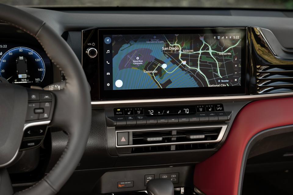 The 2025 Toyota Camry's controls include physical switches for climate and a volume dial.