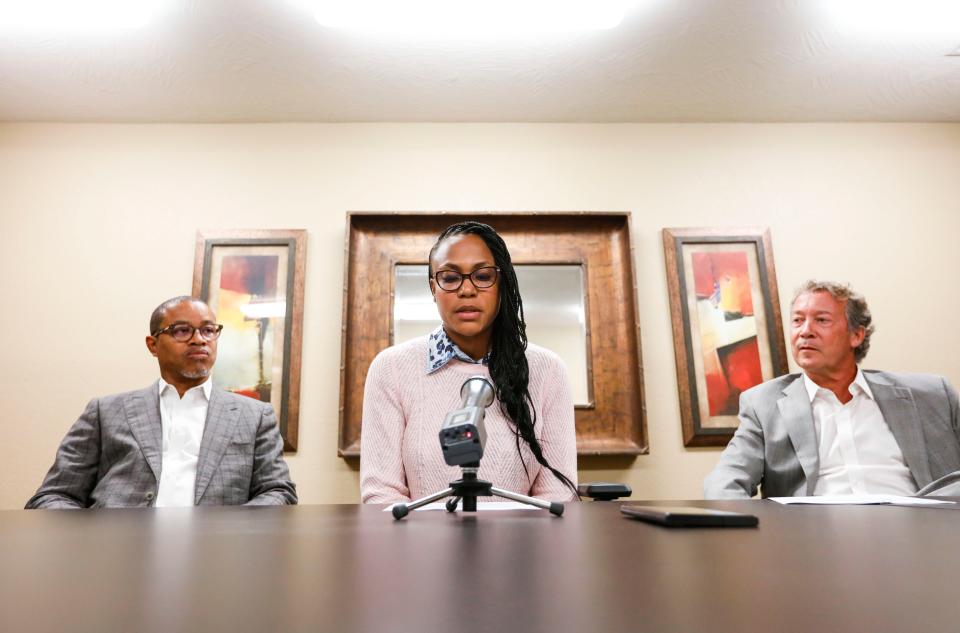 Darline Mabins, alongside husband Sean and attorney Jay Kirksey, read a statement Sept. 26 prior to appearing in front of the Springfield school board.