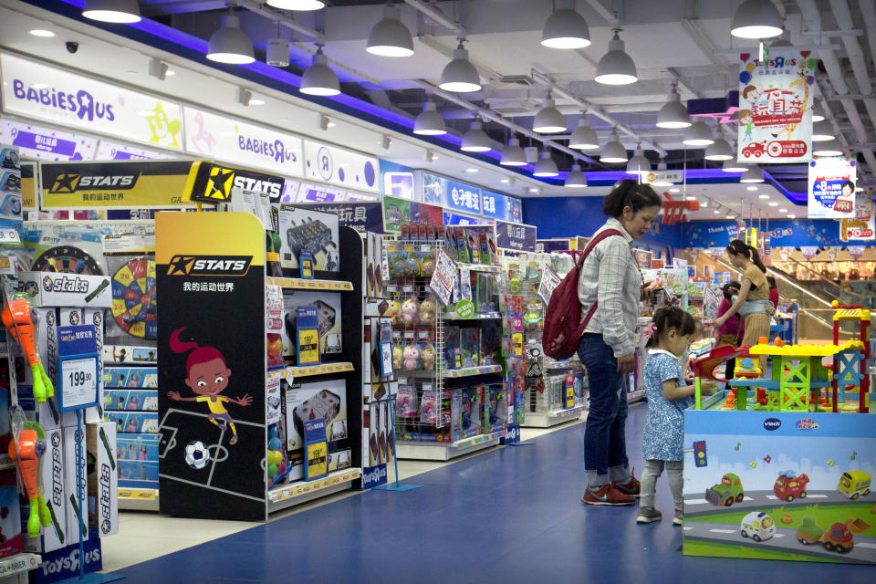 Customers shop at a toy store in Beijing, Wednesday, May 15, 2019. For many Americans, President Donald Trump's trade war may soon get very real. His administration is preparing to extend 25% tariffs to practically all Chinese imports not already hit with duties, including toys, sneakers, shirts, alarm clocks, toasters and coffeemakers. (AP Photo/Mark Schiefelbein)