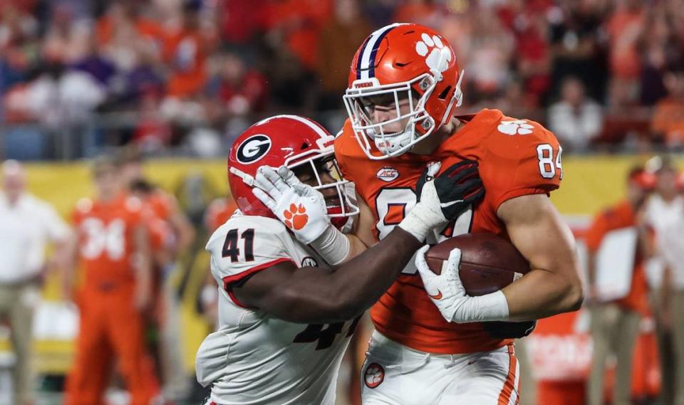 Clemson’s Davis Allen, right, gets tackled by Georgia’s Channing Tindall during the Duke’s Mayo Classic at the Bank of America Stadium in Charlotte, N.C., on Saturday, September 4, 2021. No. 5 Georgia defeated No. 3 Clemson 10-3