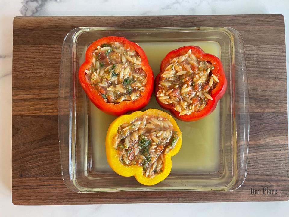 Peppers stuffed with a tomato and orzo mix.