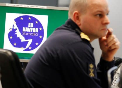 FILE PHOTO: A member of staff works at the Joint Operations Centre and Maritime Security Centre Horn of Africa during a media briefing at the EU NAVFOR Operations Headquarters at Northwood in north west London February 20, 2012. EU NAVFOR Somalia - Operation ATALANTA's main tasks are to escort merchant vessels carrying humanitarian aid of the 'World Food Program' (WFP) and vessels of 'African Union Mission in Somalia' (AMISOM), and to protect vulnerable ships in the Gulf of Aden and Indian Ocean and to deter and disrupt piracy.   REUTERS/Luke MacGregor/File Photo