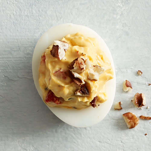 <p>Dress up your deviled eggs with a little "Caviar of the South," also known as pimiento cheese.</p> <p><a rel="nofollow noopener" href="http://www.myrecipes.com/recipe/pimiento-cheese-deviled-eggs" target="_blank" data-ylk="slk:View Recipe: Pimiento Cheese Deviled Eggs;elm:context_link;itc:0;sec:content-canvas" class="link ">View Recipe: Pimiento Cheese Deviled Eggs</a></p>