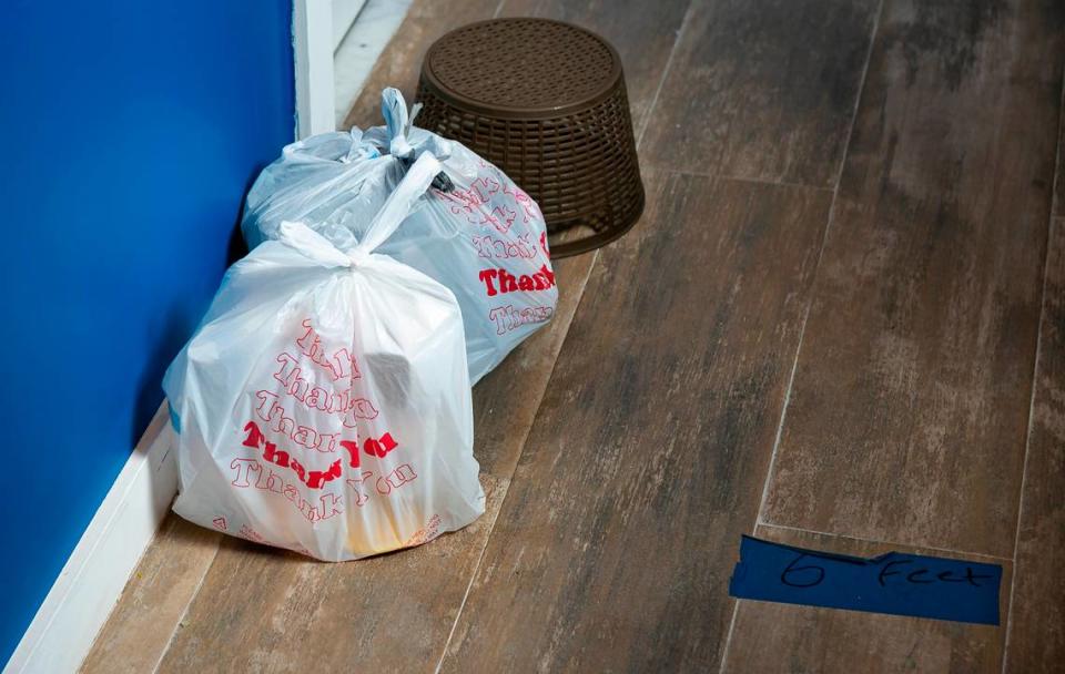 A bag with food sits outside of an occupied room inside the Dunns Josephine Hotel in MiamiÕs Overtown neighborhood on Saturday, August 22, 2020.The owner of the hotel, Kristin Kitchen, partnered with the Homeless Trust to house folks without a home who are at risk of contracting COVID-19 or became infected.