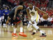 May 16, 2018; Houston, TX, USA; Golden State Warriors forward Kevin Durant (35) moves the ball against Houston Rockets guard James Harden (13) during the second half in game two of the Western conference finals of the 2018 NBA Playoffs at Toyota Center. Mandatory Credit: Thomas B. Shea-USA TODAY Sports