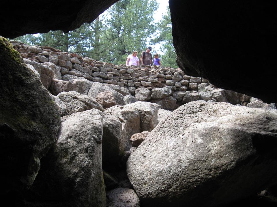 The entrance to Lava River Cave is a hole in the ground and the floor is covered with rocks and boulders.  Credit: Roger Naylor/Special for the Republic.