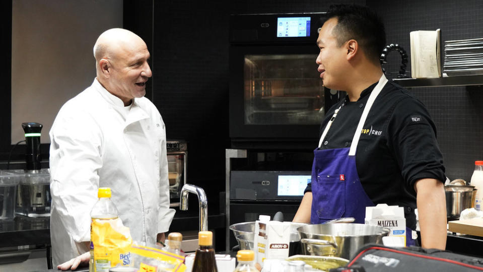 TOP CHEF -- "Fin" Episode 2014 -- Pictured: (l-r) Tom Colicchio, Buddha Lo -- (Photo by: Fred Jagueneau/Bravo)