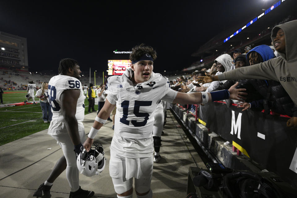 Penn State quarterback Drew Allar (15) celebrates with fans after an NCAA college football game against Maryland, Saturday, Nov. 4, 2023, in College Park, Md. (AP Photo/Nick Wass)