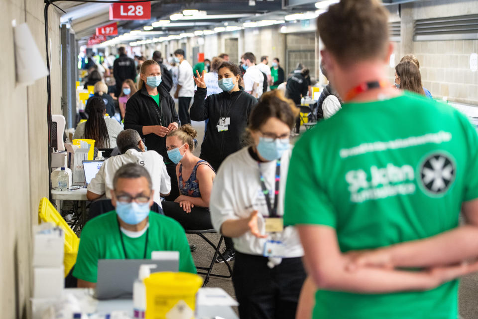 Staff and volunteers at work at a coronavirus vaccination centre at Twickenham rugby stadium, south-west London, where up to 15,000 doses are ready to be administered at the walk-in centre which has been set up for residents of north-west London in response to an increase in the number of cases of coronavirus in the area. Picture date: Monday May 31, 2021.