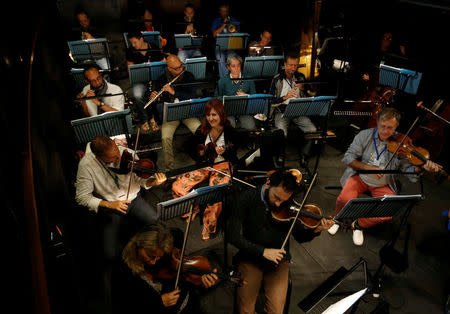 Performers take part in a dress rehearsal for the Barber of Seville ahead of the opening of the first Dubai Opera house, the UAE August 30, 2016. REUTERS/Ahmed Jadallah