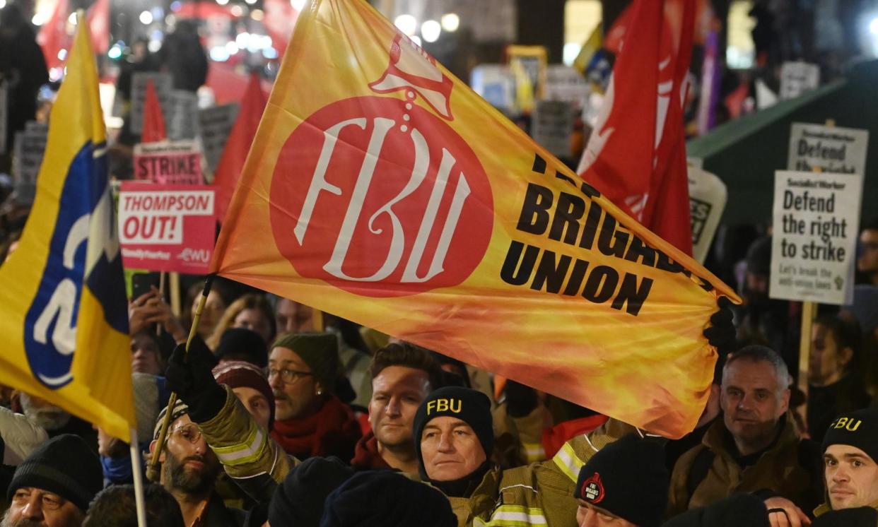 <span>Members of the Fire Brigades Union demonstrate against minimum service levels in 2023.</span><span>Photograph: Andy Rain/EPA</span>