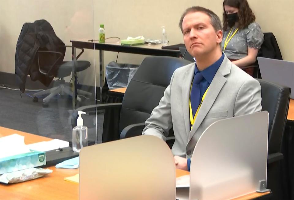 In this image from video, former Minneapolis police Officer Derek Chauvin listens as his defense attorney Eric Nelson gives closing arguments as Hennepin County Judge Peter Cahill preside Monday, April 19, 2021, in the trial of Chauvin at the Hennepin County Courthouse in Minneapolis.