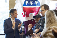 FILE - Supporters gather to hear Mehmet Oz, left, a Republican candidate for U.S. Senate in Pennsylvania, speak during a campaign event in Malvern, Pa., Saturday, Oct. 15, 2022. (AP Photo/Laurence Kesterson, File)