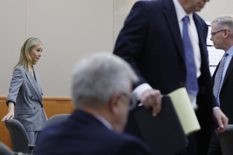 Gwyneth Paltrow stretches her legs in court during an objection by her attorney during her trial, Thursday, March 23, 2023, in Park City, Utah, where she is accused in a lawsuit of crashing into a skier during a 2016 family ski vacation, leaving him with brain damage and four broken ribs. Terry Sanderson claims that the actor-turned-lifestyle influencer was cruising down the slopes so recklessly that they violently collided, leaving him on the ground as she and her entourage continued their descent down Deer Valley Resort, a skiers-only mountain known for its groomed runs, après-ski champagne yurts and posh clientele. (AP Photo/Jeff Swinger, Pool)