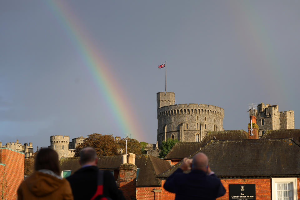 <p>WINDSOR, ENGLAND - SEPTEMBER 08: The Union flag is lowered on Windsor Castle as a rainbow covers the sky on September 08, 2022 in Windsor, England. Elizabeth Alexandra Mary Windsor was born in Bruton Street, Mayfair, London on 21 April 1926. She married Prince Philip in 1947 and acceded the throne of the United Kingdom and Commonwealth on 6 February 1952 after the death of her Father, King George VI.Queen Elizabeth II died at Balmoral Castle in Scotland on September 8, 2022, and is survived by her four children, Charles, Prince of Wales, Anne, Princess Royal, Andrew, Duke Of York and Edward, Duke of Wessex. (Photo by Chris Jackson/Getty Images)</p> 