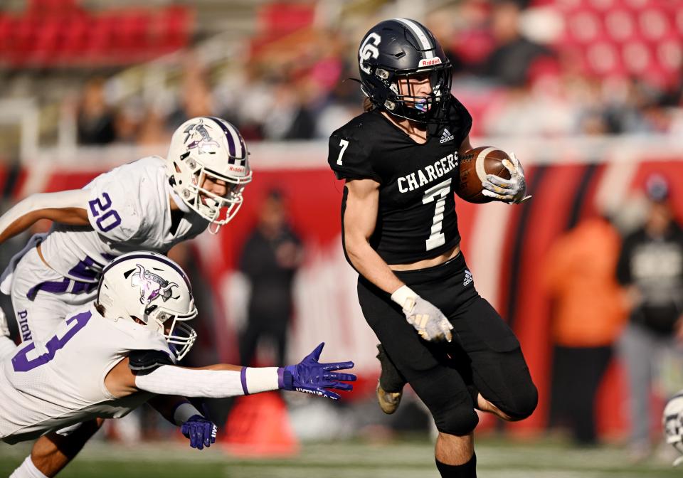 Corner Canyon’s Bryton Brady outruns Lehi’s Max Ray on his way in for a touchdown as they play in high school football semifinal action at Rice-Eccles Stadium in Salt Lake City on Friday, Nov. 10, 2023. Corner Canyon won 63-24. | Scott G Winterton, Deseret News