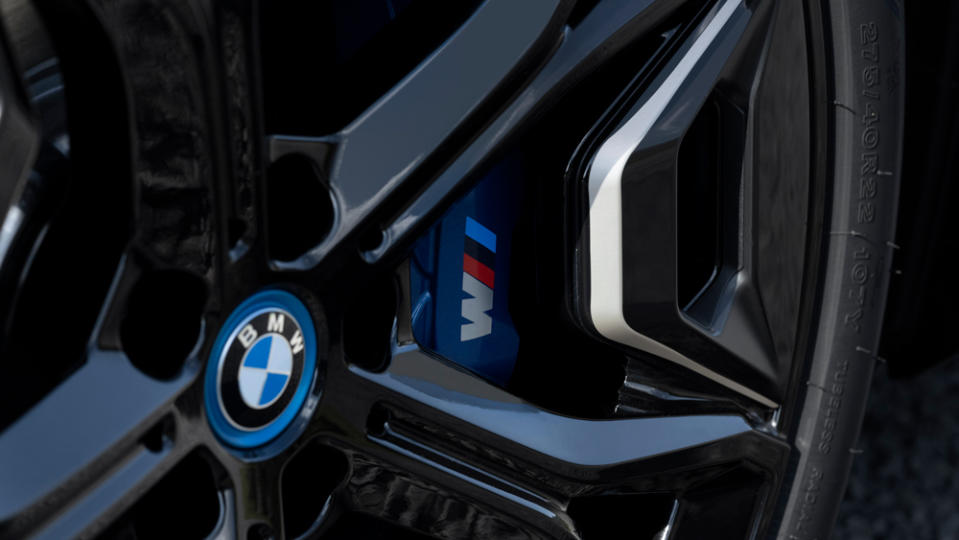 A detail of a wheel on the all-electric BMW iX M60.