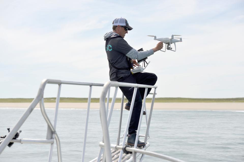 Brian Hanson, a volunteer research assistant and a board member of the Atlantic White Shark Conservancy, prepares to launch a DJI Phantom Pro 4 drone Monday to help search for great white sharks off Monomoy