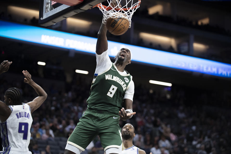 FILE - Milwaukee Bucks center Bobby Portis (9) dunks during the second half of the team's NBA basketball game against the Sacramento Kings in Sacramento, Calif., Wednesday, March 16, 2022. Now that he's signed a long-term deal to stay with the Bucks, Portis is eager to help them attempt another title run. (AP Photo/José Luis Villegas, File)