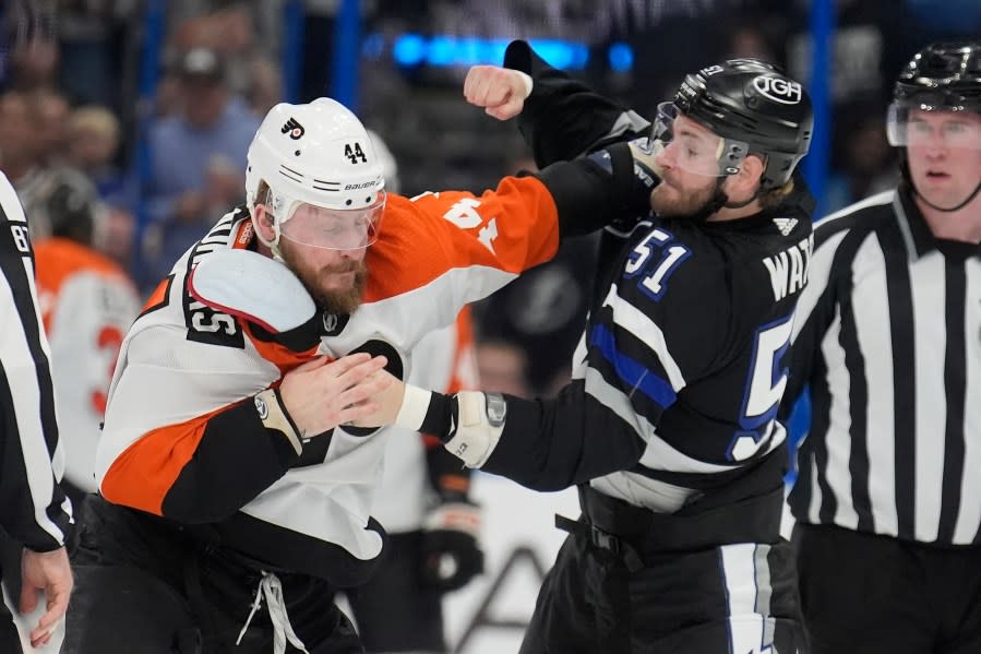 Philadelphia Flyers left wing Nicolas Deslauriers (44) and Tampa Bay Lightning left wing Austin Watson (51) fight during the first period of an NHL hockey game Saturday, March 9, 2024, in Tampa, Fla. (AP Photo/Chris O’Meara)