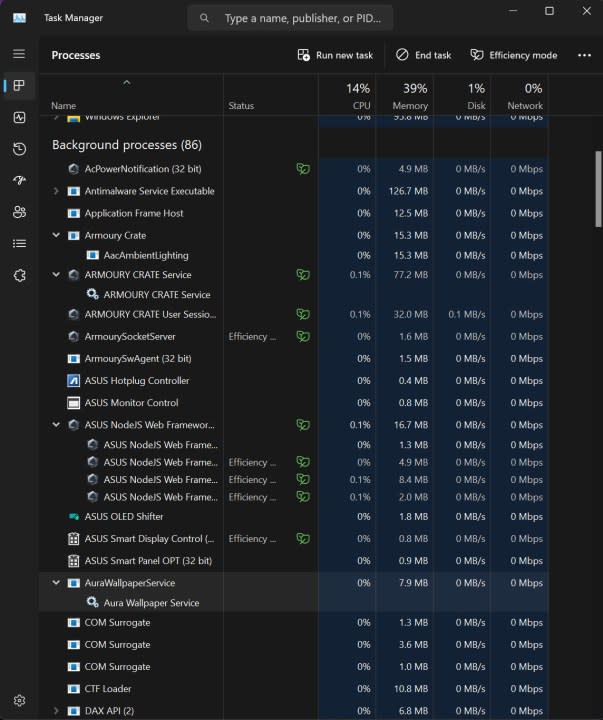 A screenshot of Windows Task Manager showing numerous processes being run by Armoury Crate software.