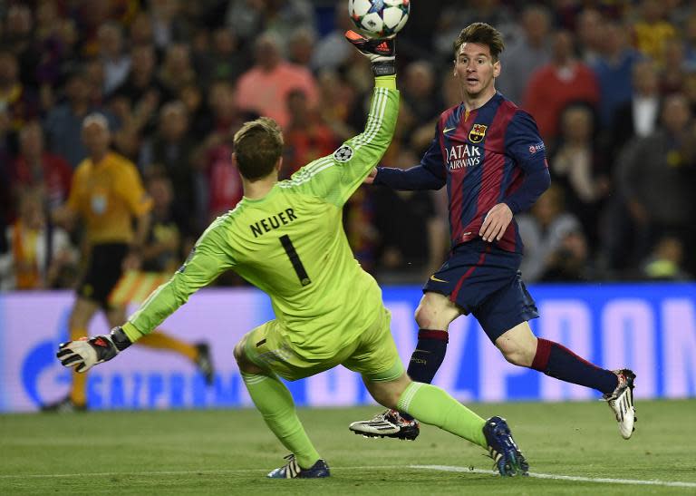 Barcelona's Lionel Messi scores past bayern Munich goalkeeper Manuel Neuer during their Champions League match at Camp Nou stadium on May 6, 2015