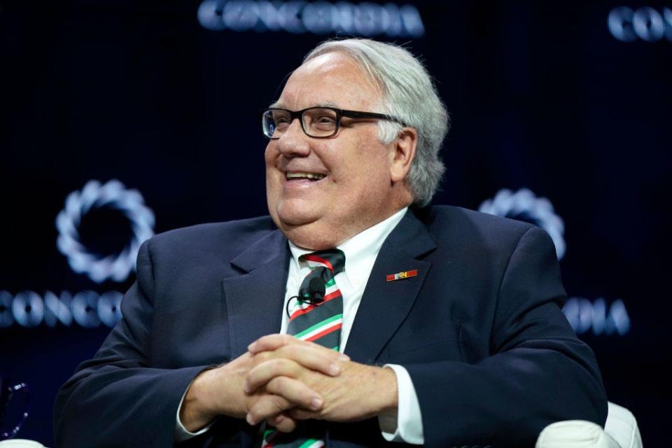Howard Buffett, Warren Buffett's son, sits on a stage.