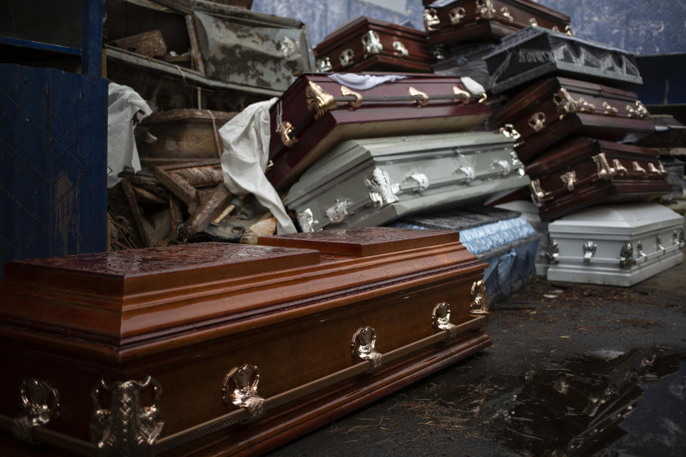 MEXICO CITY, MEXICO - MAY 7: Empty coffins from COVID-19 victims are stocked inside the Xilotepec cemetery in Xochimilco as they await its destruction on May 7, 2020 in Mexico City, Mexico. Mexico is on Stage Three of health emergency, as deaths and positive cases grow. According to Health Ministry, Mexico faces the most dangerous week with an exponential spread of contagion. While only essential activities are permitted, government suggests population to stay at home but quarantine is not obligatory as there is major concern about the economic activity. Social distancing measures could be over between May 18 and 30. (Photo by Cristopher Rogel Blanquet/Getty Images)