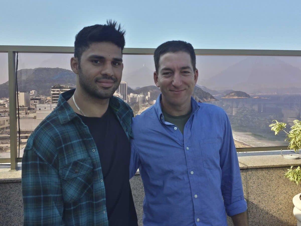 Guardian journalist Glenn Greenwald, right, and his partner David Miranda (AP)