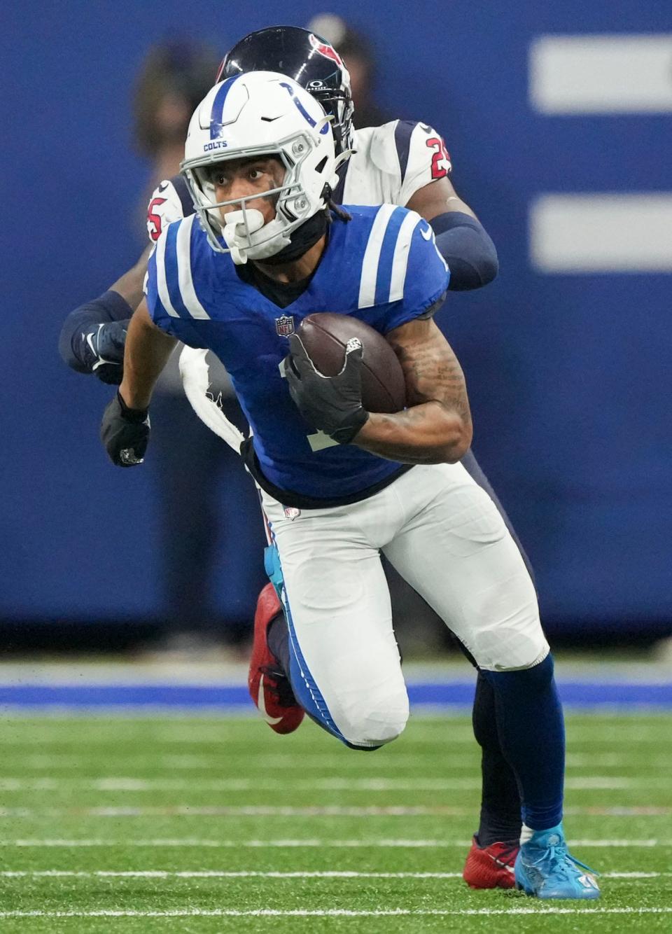 Indianapolis Colts wide receiver Josh Downs (1) rushes the ball Saturday, Jan. 6, 2024, during a game against the Houston Texans at Lucas Oil Stadium in Indianapolis.
