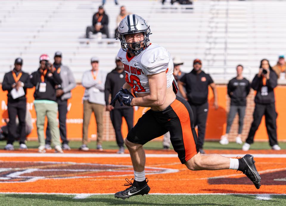 University of New Hampshire football senior Dylan Laube goes through drills at the Reese's Senior Bowl in February. Multiple reports surfaced that said Laube's NFL stock rose more than anyone from the week-long camp and game in Alabama.