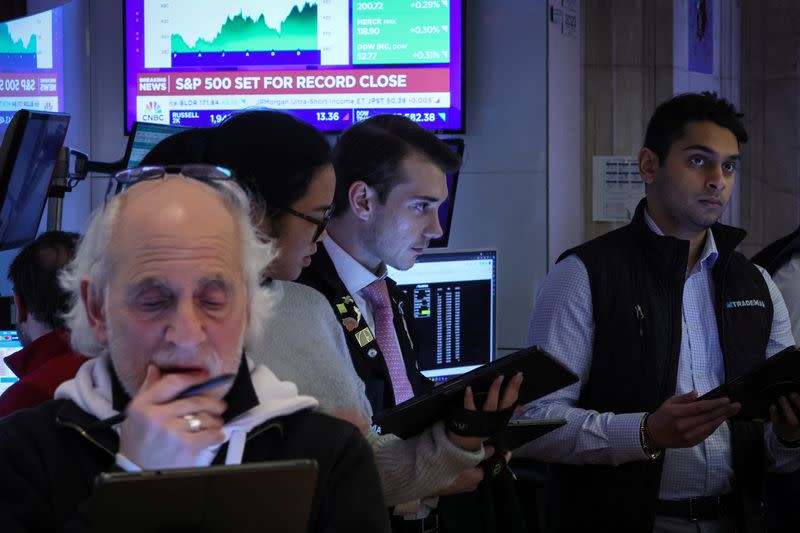 Traders work on the floor of the NYSE in New York