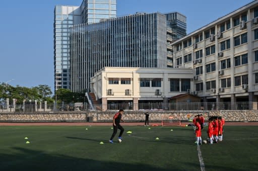 Former Manchester United player Dong Fangzhuo coaches children in Xiamen