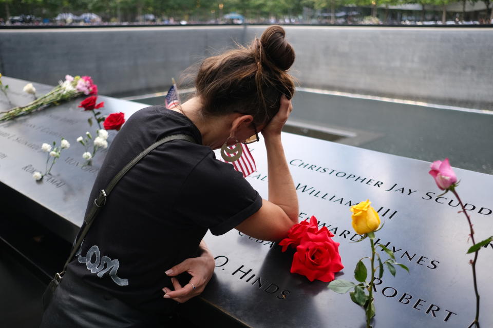 A woman mourns as she visits the 9/11 Memorial on the 20th anniversary of the September 11, 2001 attacks in New York City, New York, U.S., September 11, 2021.  (Amr Alfiky/Reuters)